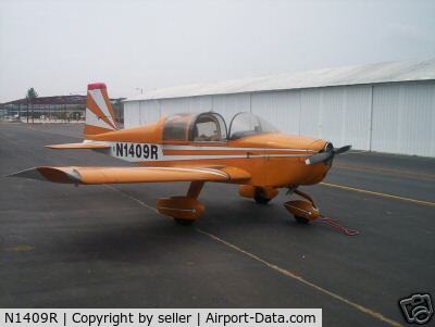 N1409R, 1974 Grumman American AA-1B Trainer C/N AA1B-0509, Missing one wing after being hit by stray Cherokee on ramp.