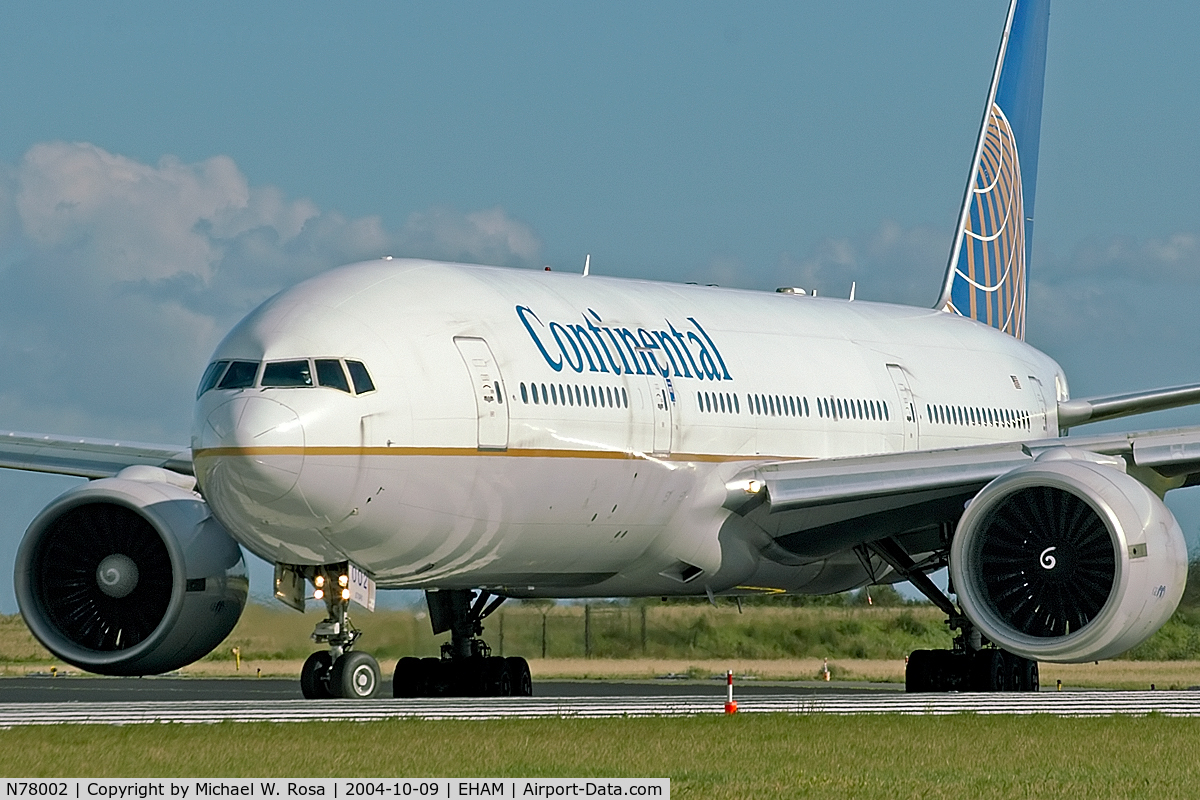 N78002, 1998 Boeing 777-224 C/N 27578, Rotating onto runway 36L.