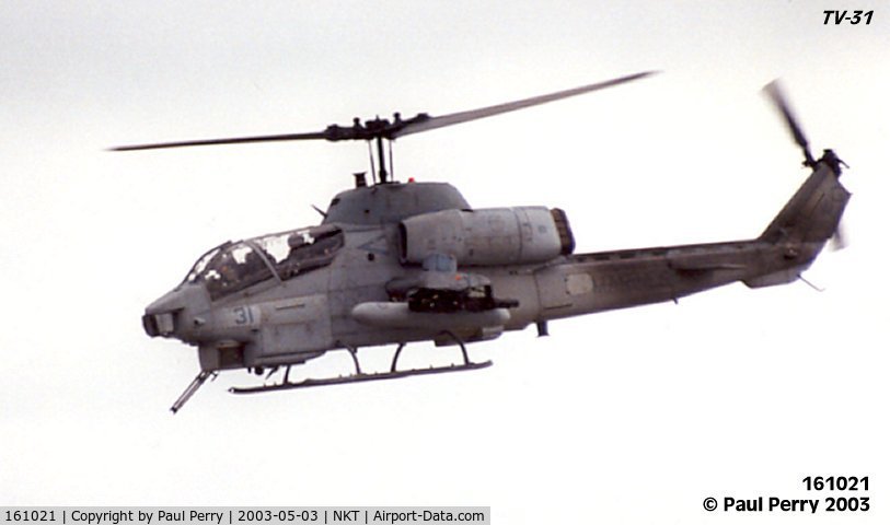 161021, Bell AH-1W Super Cobra C/N 26926, The gunner is playing the M-197 cannon around, and it looks menacing!