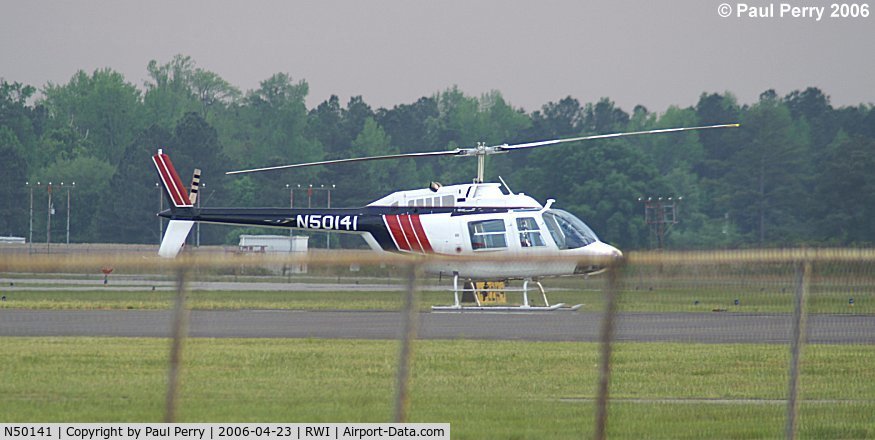 N50141, 1979 Bell 206B-III C/N 2603, Fine study of a Bell, even with the fence.