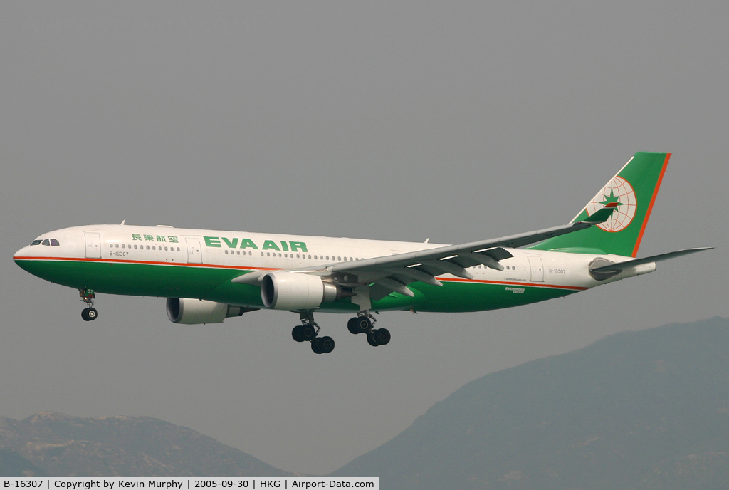 B-16307, 2004 Airbus A330-203 C/N 634, EVA A.330 drifting into Hong Kong on a hazy day.