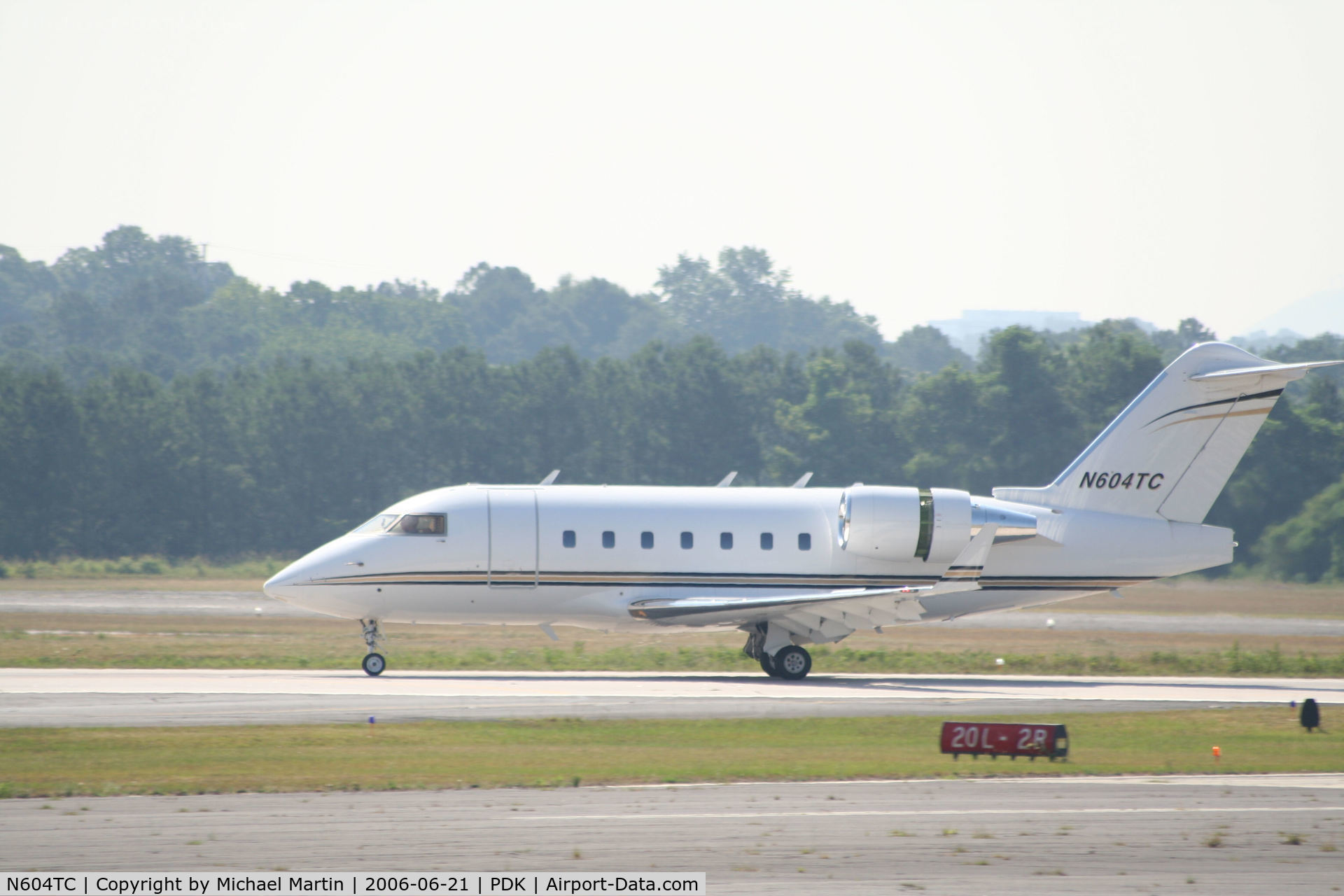 N604TC, 1996 Canadair Challenger 604 (CL-600-2B16) C/N 5323, Landing 20R with airbrakes extended