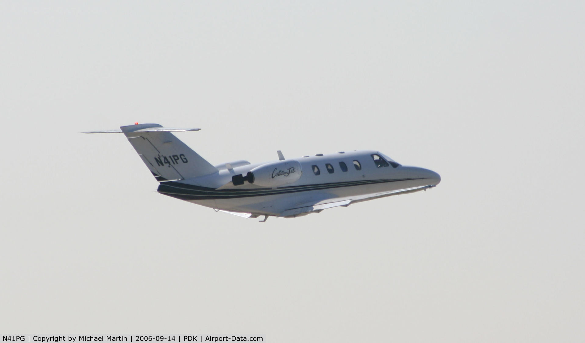 N41PG, 1997 Cessna 525 C/N 525-0175, Gear up after take off from 20L