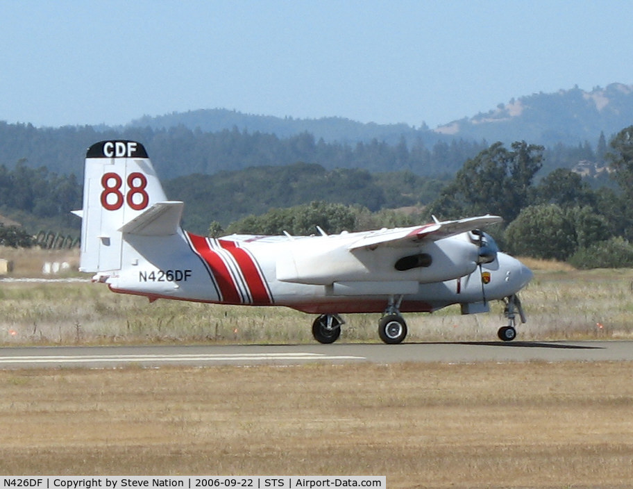 N426DF, 1999 Marsh Aviation S-2F3AT C/N 152824, Grass Valley-based CDF S-2T Tanker #88 with Bob Finer at the controls touching down in nasty crosswind at Sonoma County Airport, CA following firefighting mission