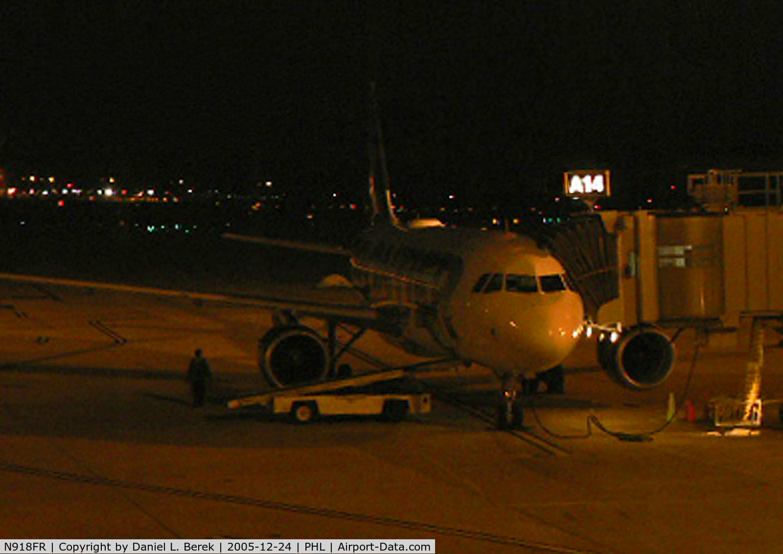 N918FR, 2003 Airbus A319-111 C/N 1943, A Frontier A319 waits in the predawn darkness for its return trip to Denver. This aircraft features the whitetail deer on its tail. Beautiful aircraft!