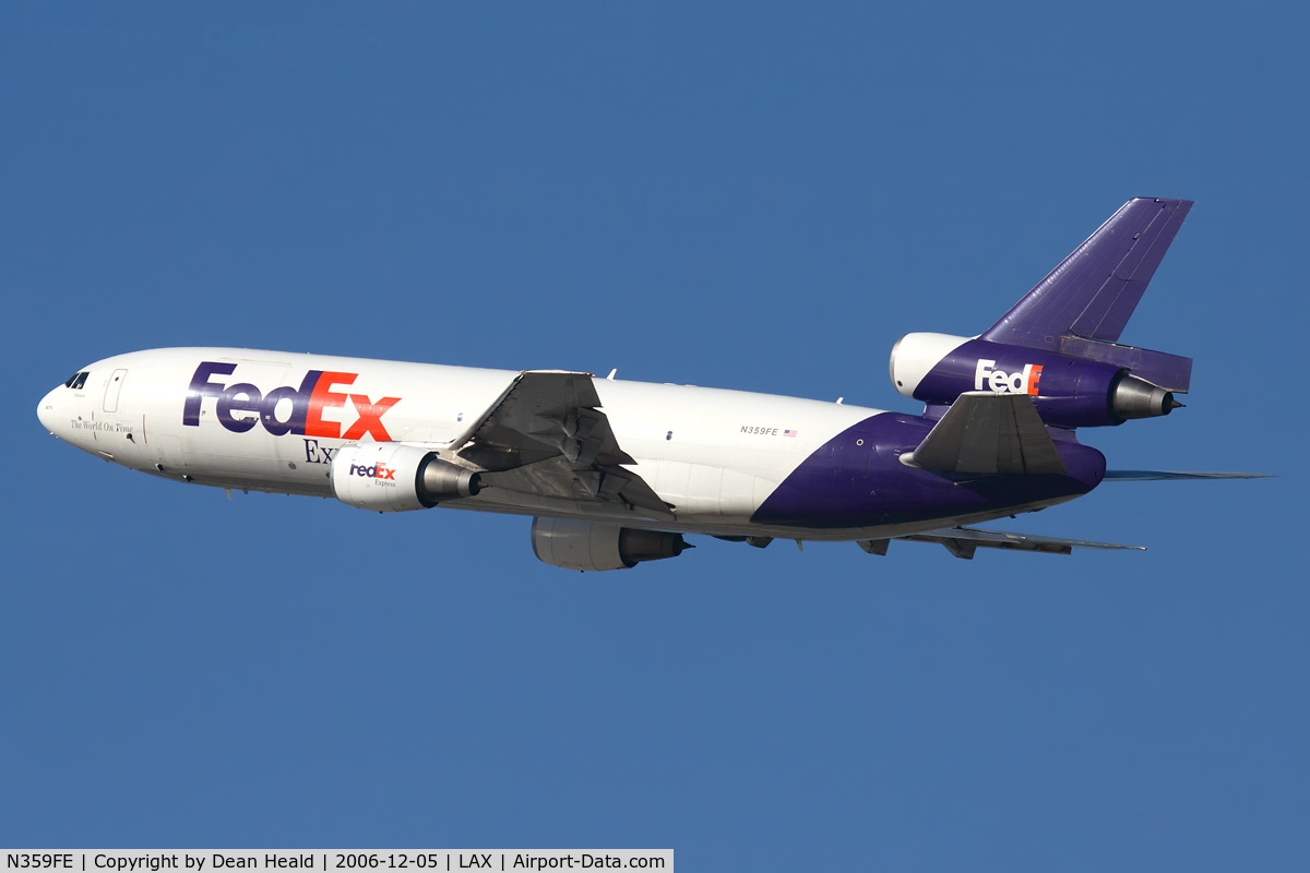 N359FE, 1980 McDonnell Douglas MD-10-10F C/N 46635, FedEx N359FE (FLT FDX3019) climbing out from RWY 25R enroute to Chicago O'Hare Int'l (KORD).  Note that the 'x' in FedEx on the tail is missing.