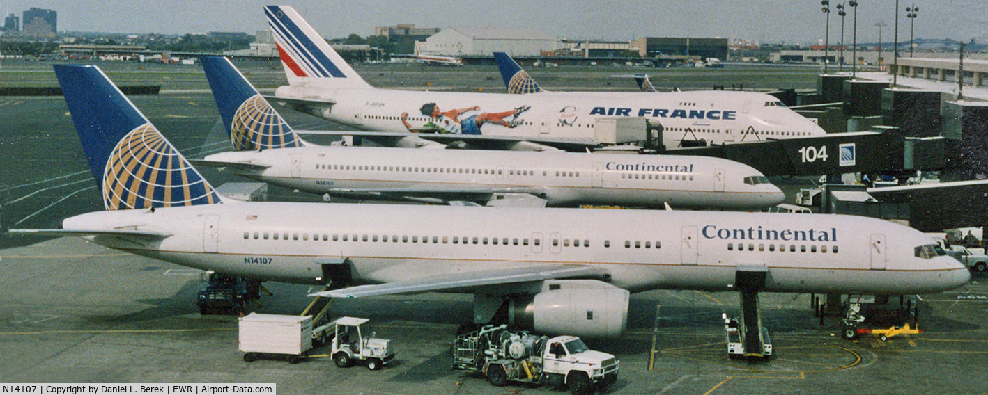 N14107, 1994 Boeing 757-224 C/N 27297, A Continental 757-224 joins other interesting aircraft at Newark's Terminal C in 1999.
