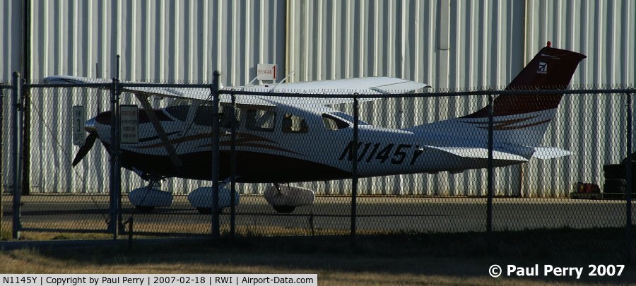 N1145Y, 2006 Cessna 206H Stationair C/N 20608280, Sequestered behind the fence