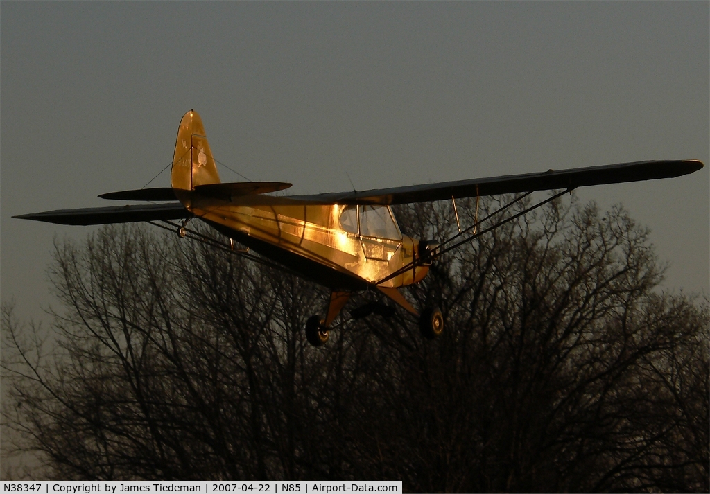 N38347, 1941 Piper J3C-65 Cub C/N 6955, This Cub glides down on to runway two-six on a glorious April evening.