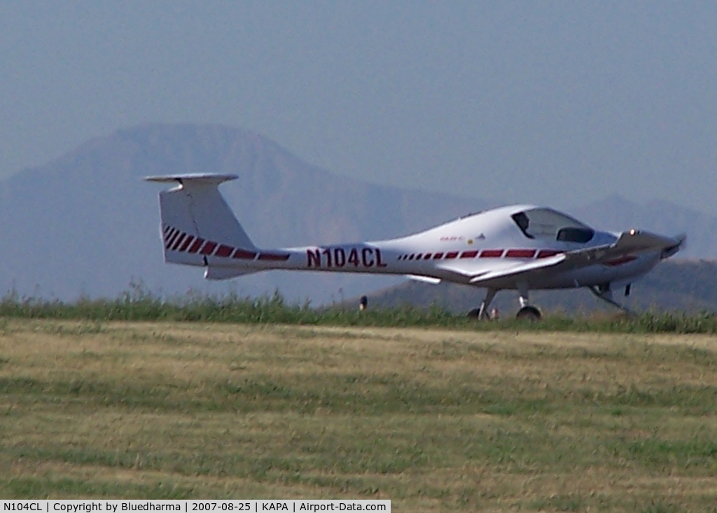 N104CL, 1998 Diamond DA-20C-1 Eclipse C/N C0004, Taxi to runway, with Pikes Peak in the background.