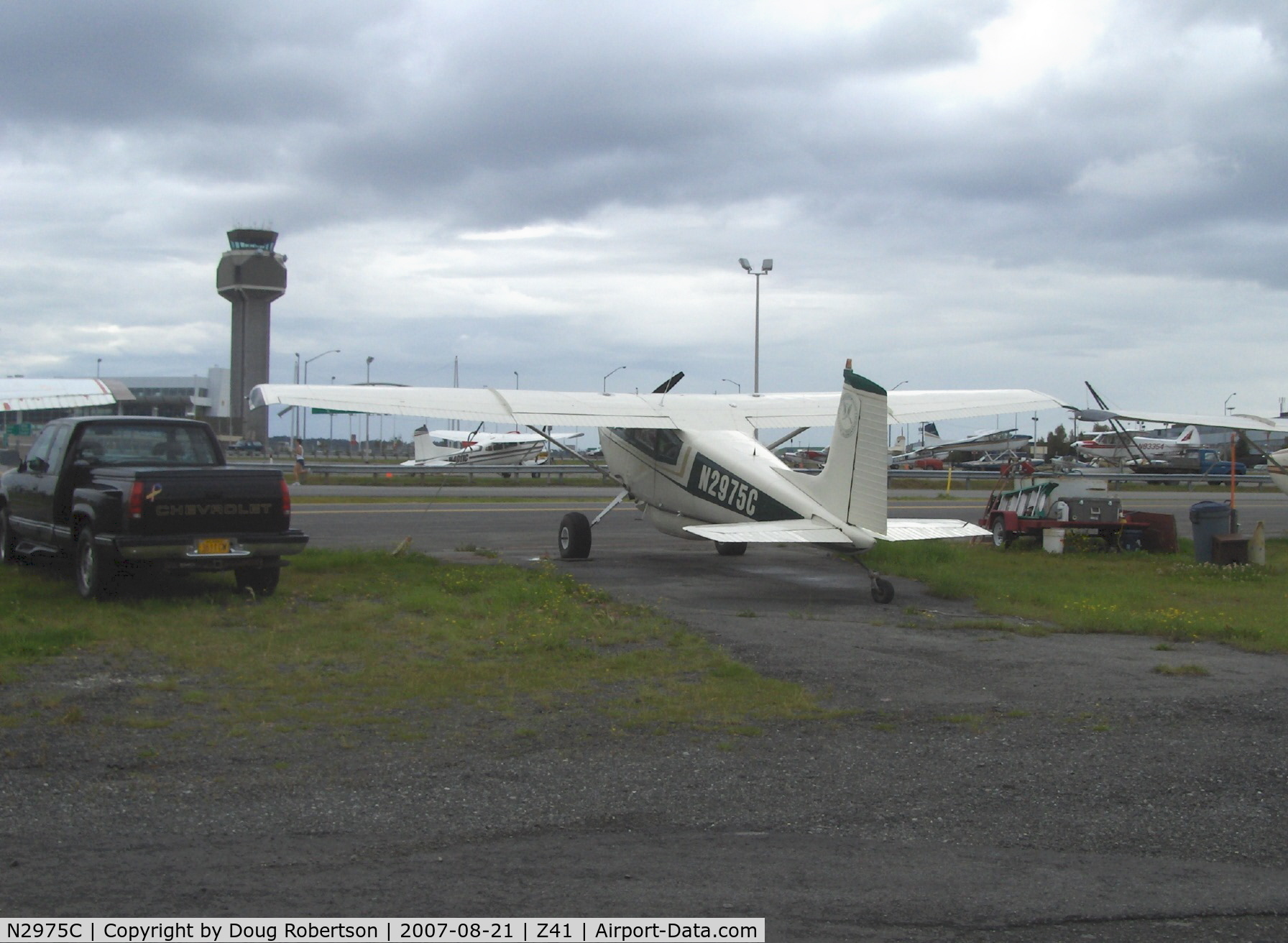 N2975C, 1954 Cessna 180 C/N 30875, 1954 Cessna 180 SKYWAGON, Continental O-470 230 Hp upgrade, ANC Tower in background