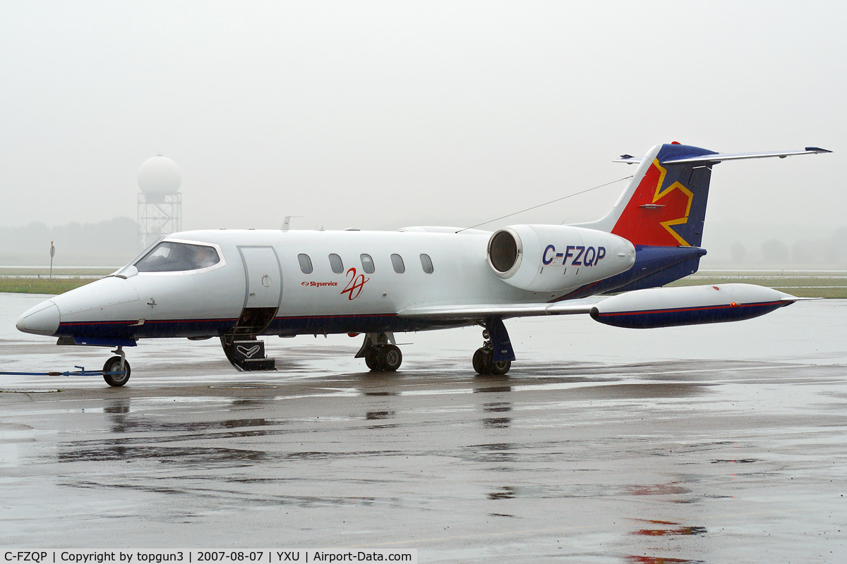 C-FZQP, 1978 Learjet 35A C/N 168, Parked in the rain at Esso ramp.