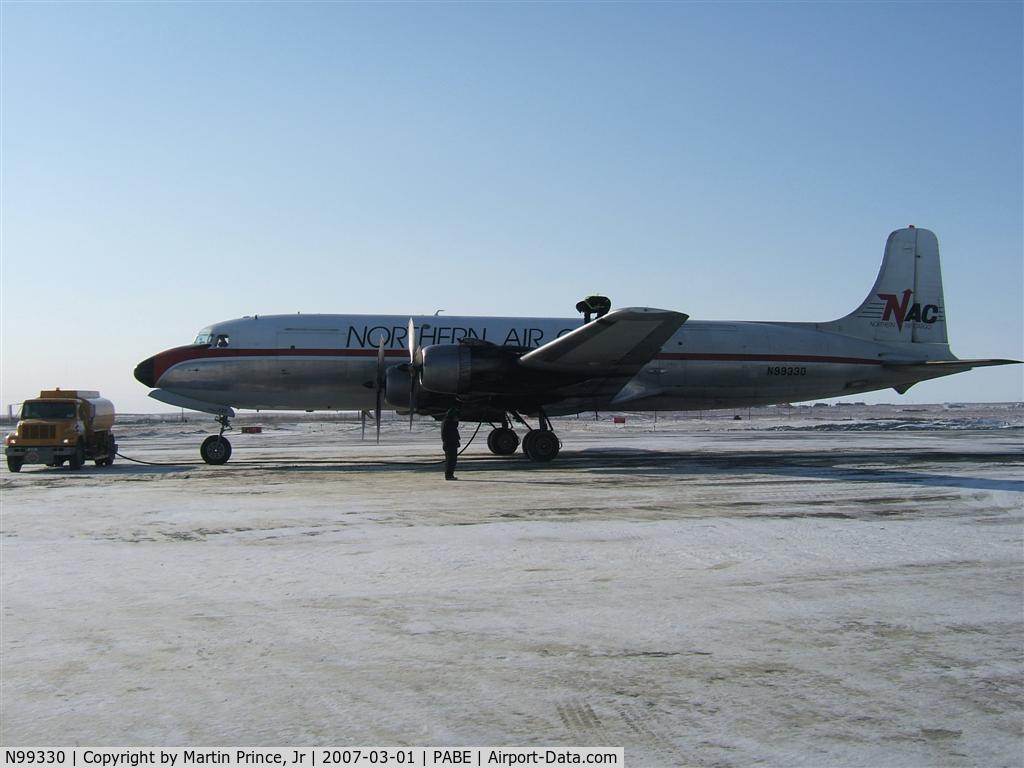 N99330, 1952 Douglas C-118A Liftmaster (DC-6A) C/N 43576, Northern Air Cargo on a cold winters day