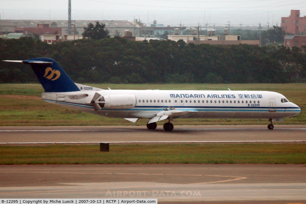 B-12295, 1994 Fokker 100 (F-28-0100) C/N 11527, Just touched down, thrust reversers deployed