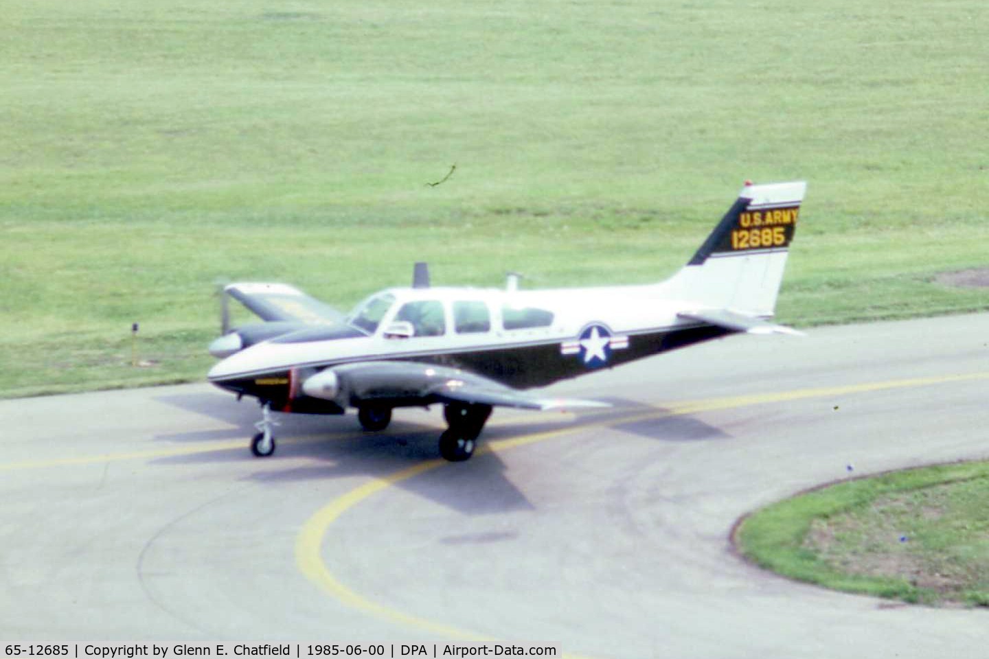 65-12685, 1965 Beech B-55 Baron (T-42A) C/N TF-7, T-42A 65-12685 when still active with the Army, taxiing by the control tower.