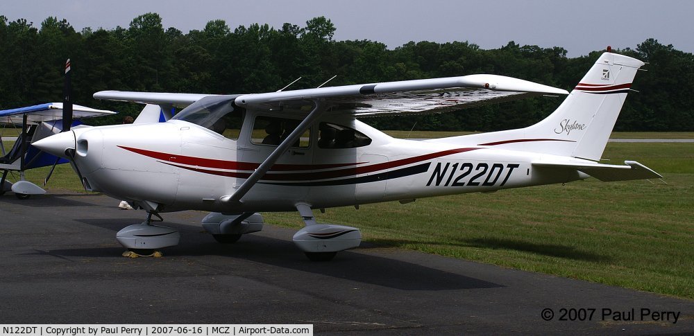 N122DT, 2000 Cessna 182S Skylane C/N 18280908, This young lady really stands out against the forest