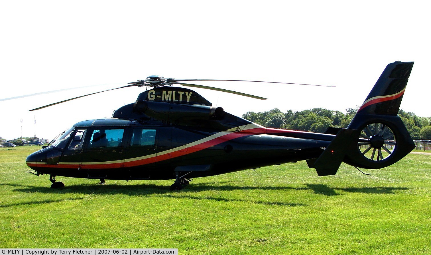 G-MLTY, 1991 Aerospatiale AS-365N-2 Dauphin C/N 6431, Helicopters arrive at the temporary Heliport on 2007 Epsom Derby Day (Horse racing)