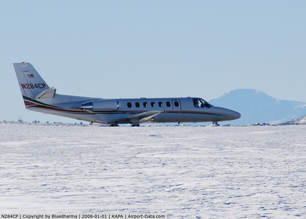 N284CP, 1996 Cessna 560 C/N 560-0358, Taxi to takeoff with Pikes Peak in the distance.