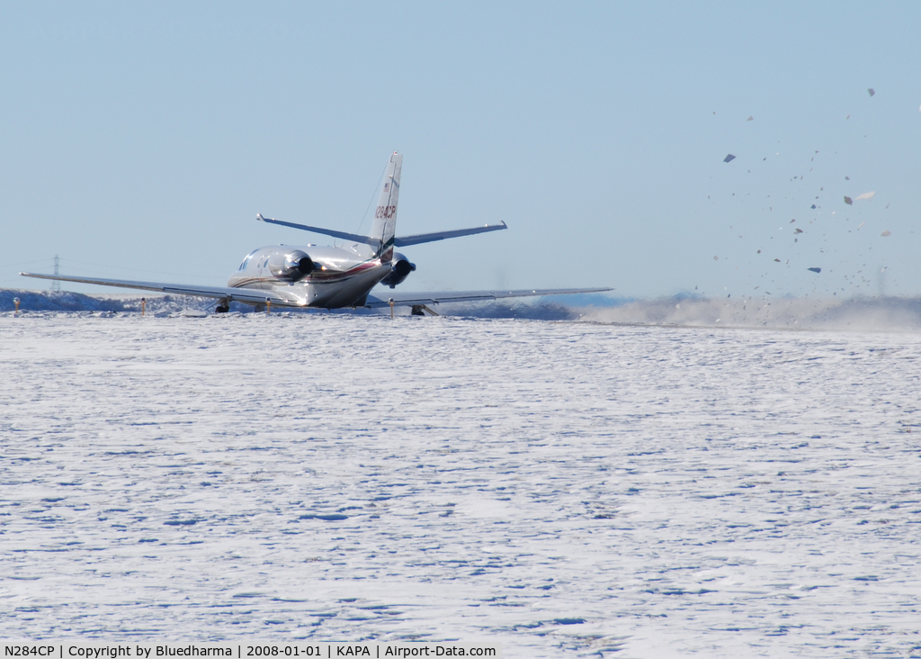 N284CP, 1996 Cessna 560 C/N 560-0358, Takeoff and full power. Look at the snow fly!