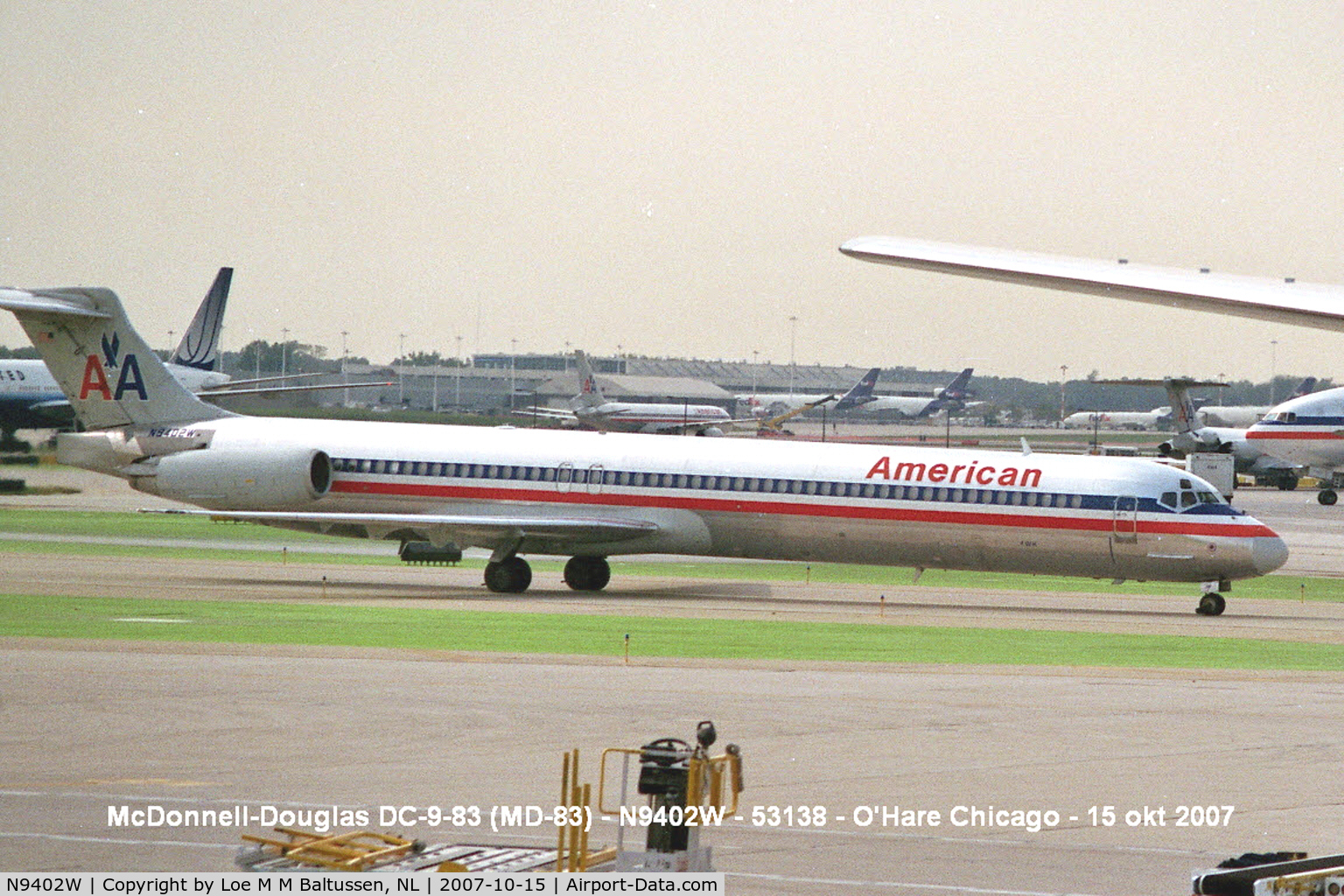 N9402W, 1992 McDonnell Douglas MD-83 (DC-9-83) C/N 53138, A long Niner passing Terminal 2, O'Hare, a small Grumman F-15 Wildcat (BuNo 12320) attracks more attention than the big Jumbo's ouside