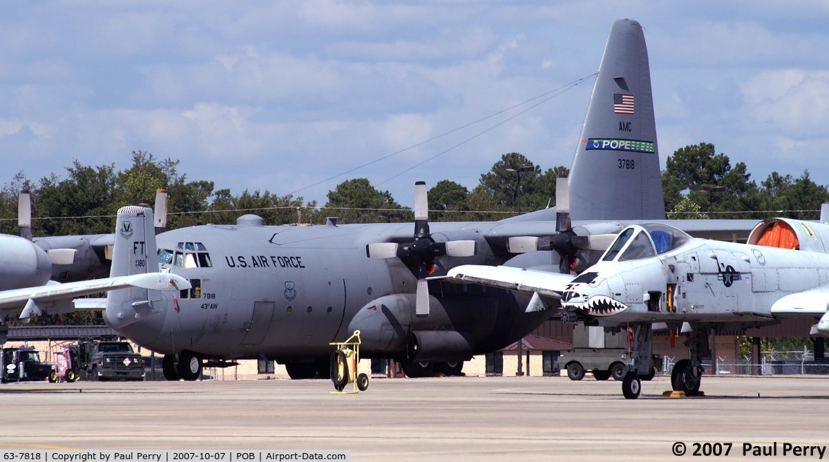 63-7818, 1963 Lockheed C-130E-LM Hercules C/N 382-3884, Looks like the Warthogs are guarding the Hercs