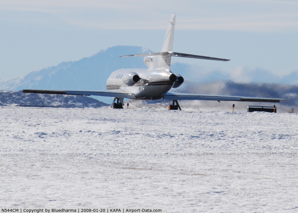 N544CM, 1987 Dassault Falcon 50 C/N 173, Takeoff on 17L. Pikes peak in the distance.