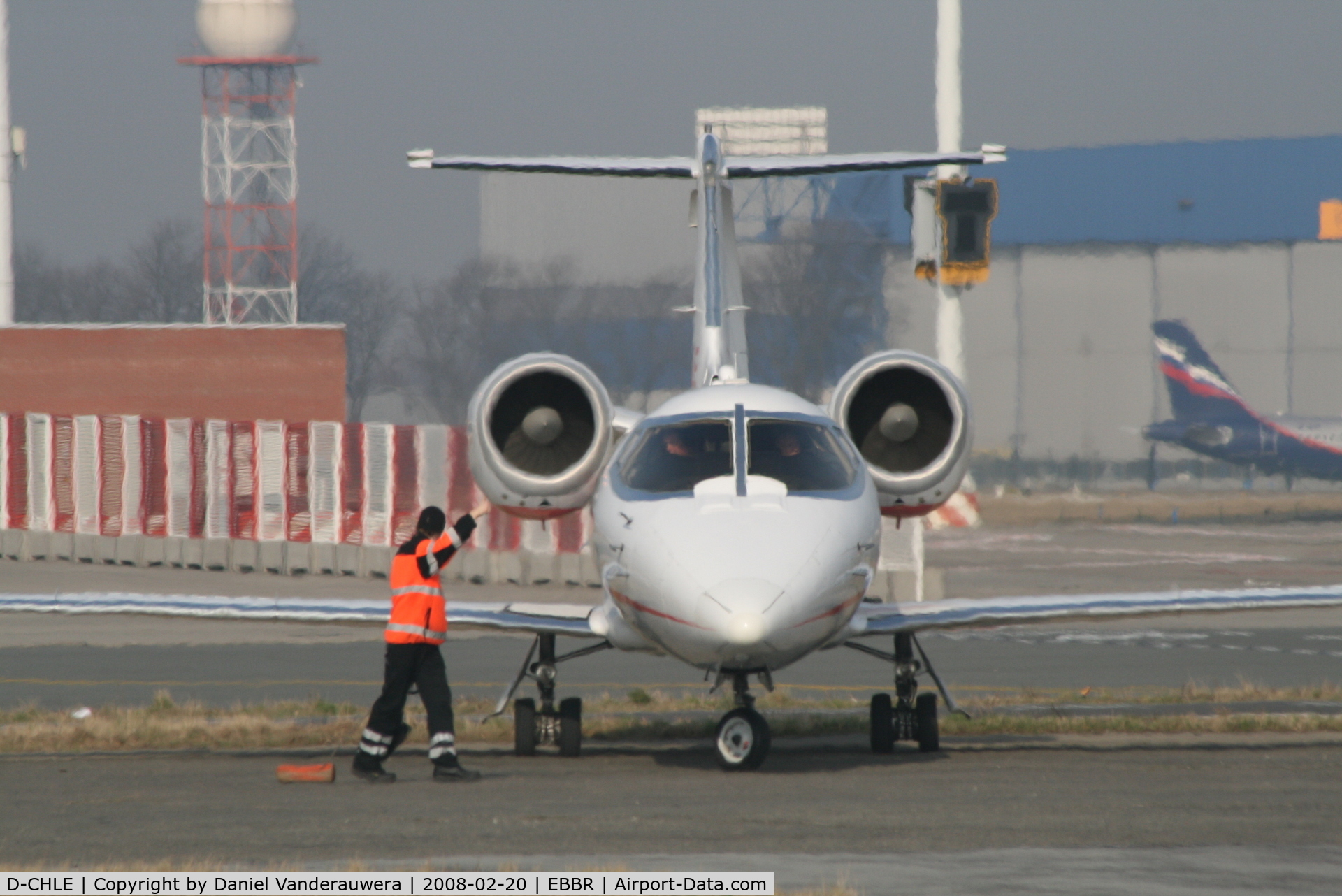 D-CHLE, 2001 Learjet 60 C/N 60-211, manoeuvring to park on General Aviation apron