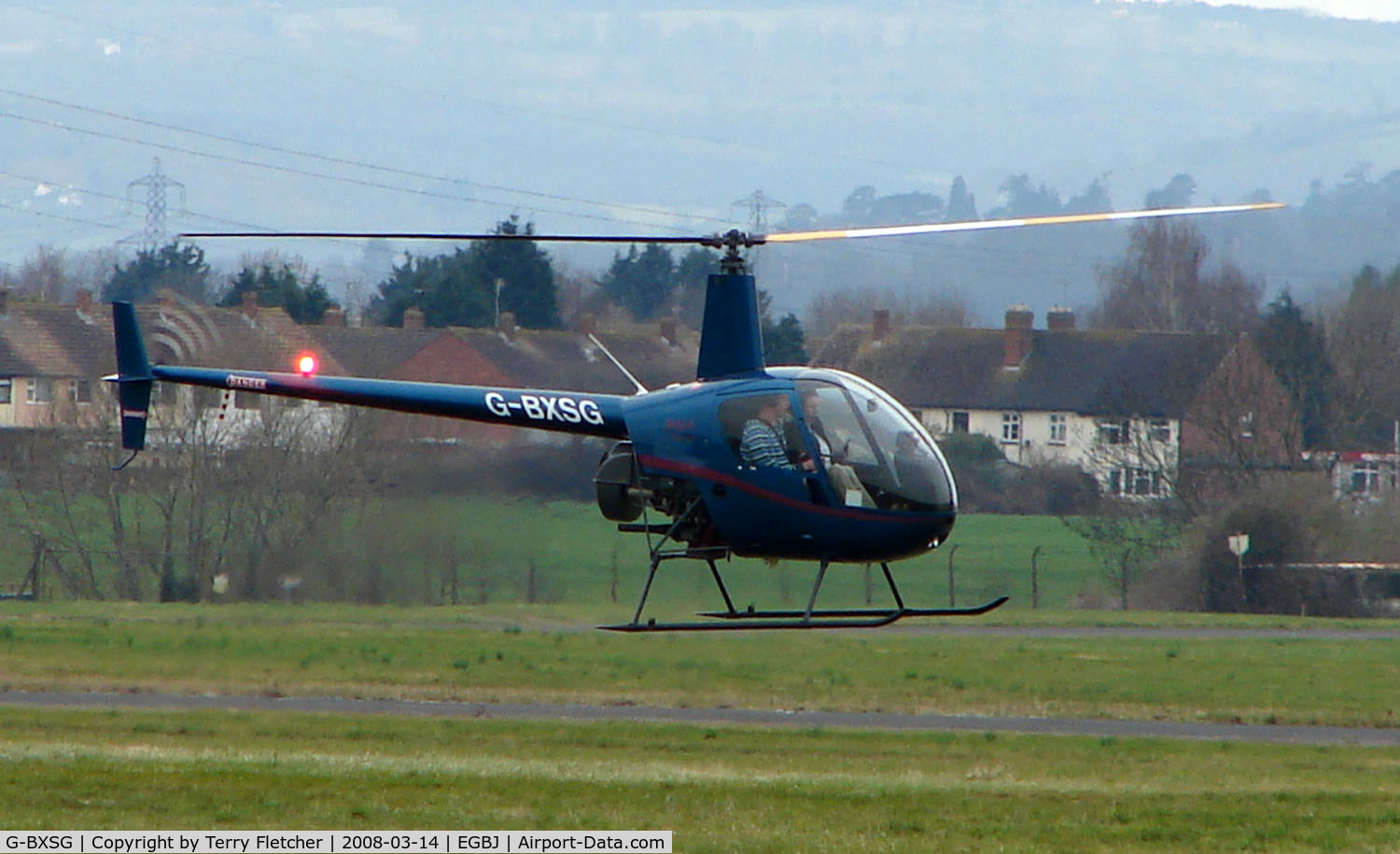G-BXSG, 1998 Robinson R22 Beta C/N 2789, A visitor to Gloucestershire Airport on the day of the horse racing Gold Cup  at the nearby Cheltenham Racecourse