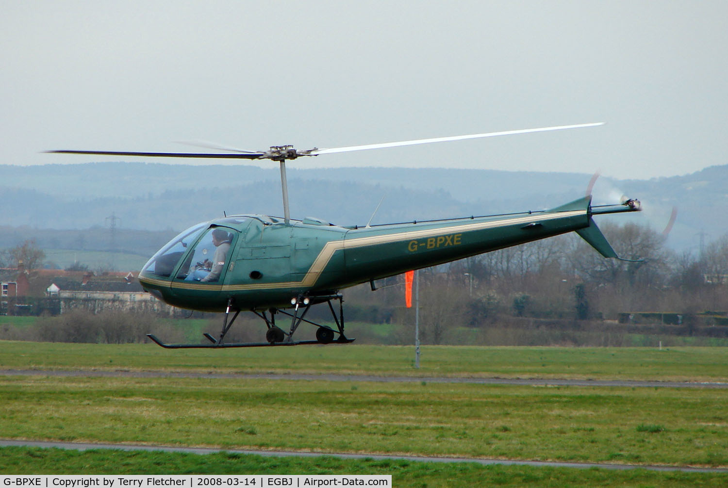 G-BPXE, 1977 Enstrom 280C Shark C/N 1089, A visitor to Gloucestershire Airport on the day of the horse racing Gold Cup  at the nearby Cheltenham Racecourse