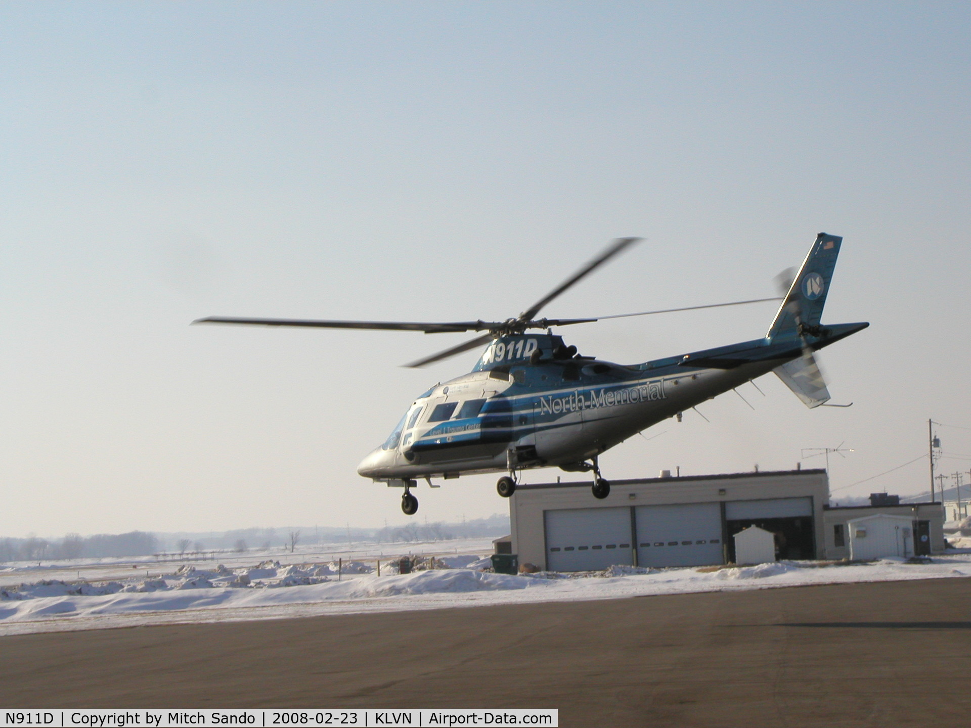 N911D, Agusta A-109C Max C/N 7637, Departing the ramp for a scene flight in Waseca County, which they got cancelled to and returned about 15 minutes later.