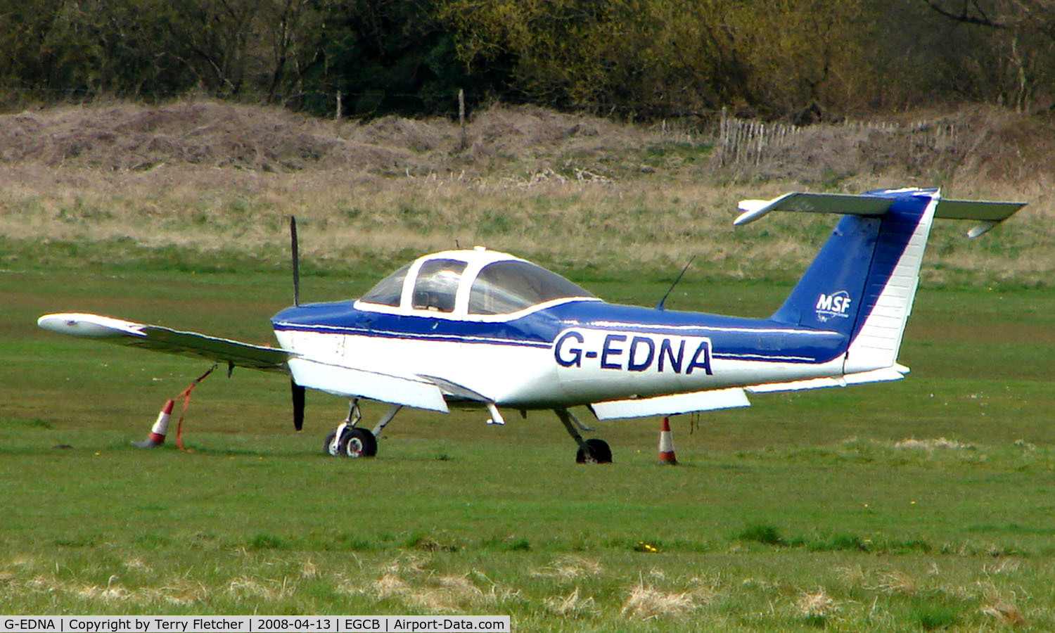 G-EDNA, 1978 Piper PA-38-112 Tomahawk Tomahawk C/N 38-78A0364, Piper Tomahawk parked remotely  at a waterlogged  Barton