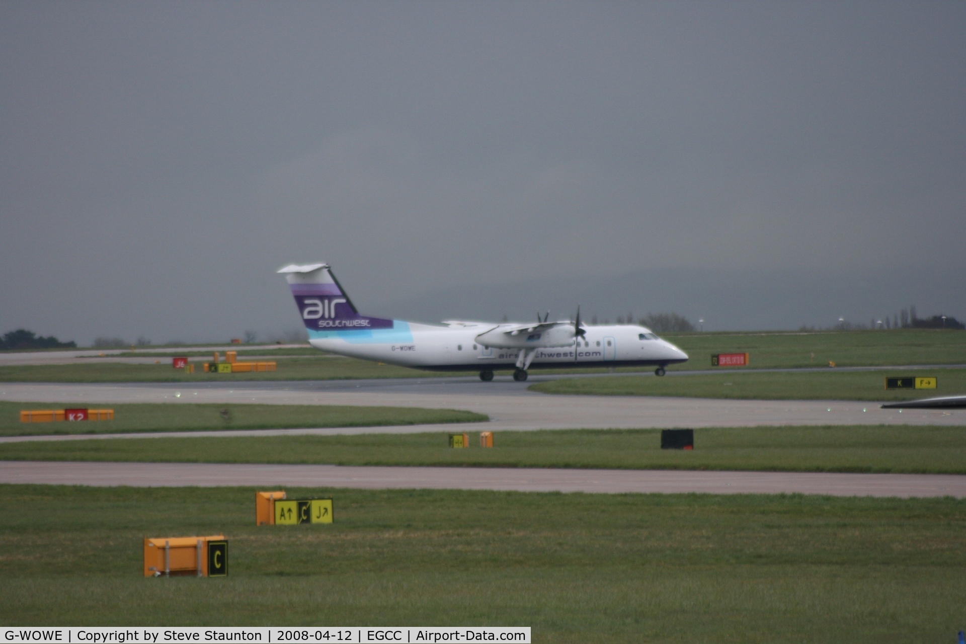 G-WOWE, 1991 De Havilland Canada DHC-8-311 Dash 8 C/N 256, Taken at Manchester Airport on a typical showery April day