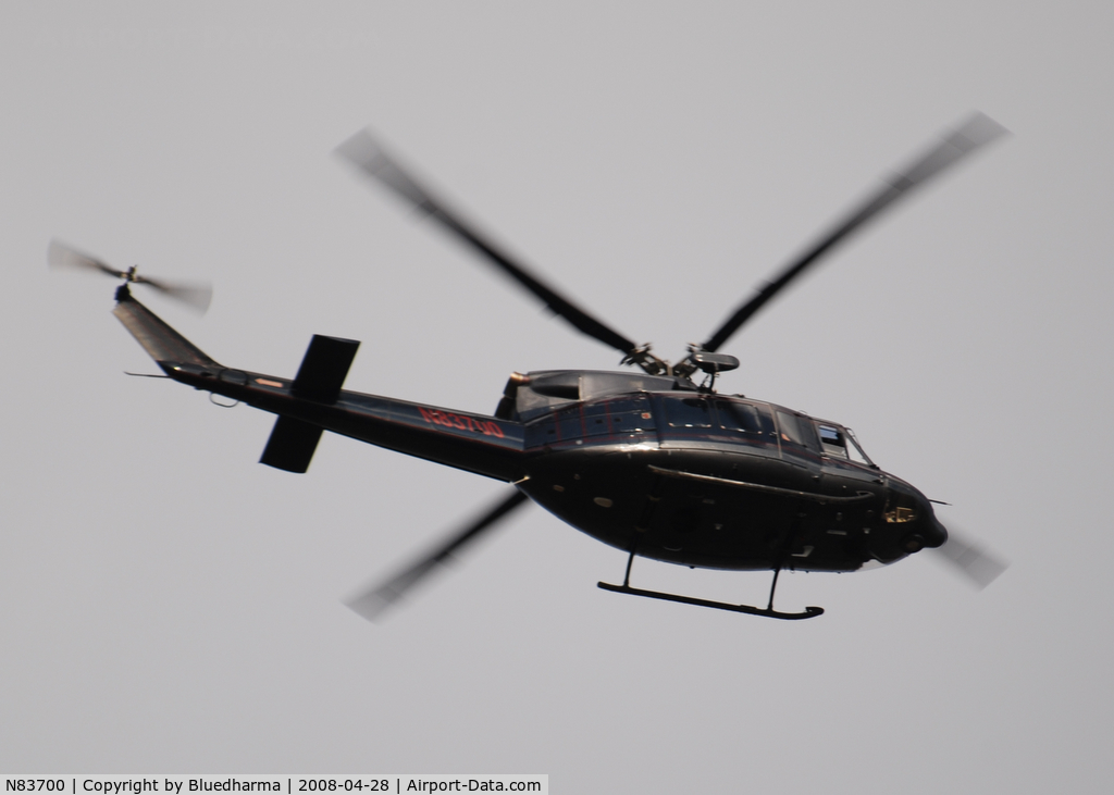 N83700, 1998 Bell 412 C/N 36208, Flying East over Columbine Highschool in formation with helicopter N515JW.