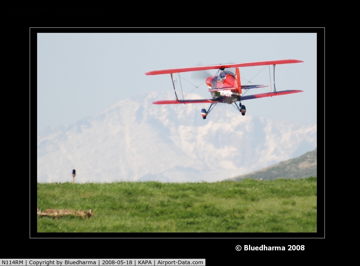 N114RM, 1999 Aviat Pitts S-2C Special C/N 6030, Pitts on approach to 17L. Pikes Peak in the background.