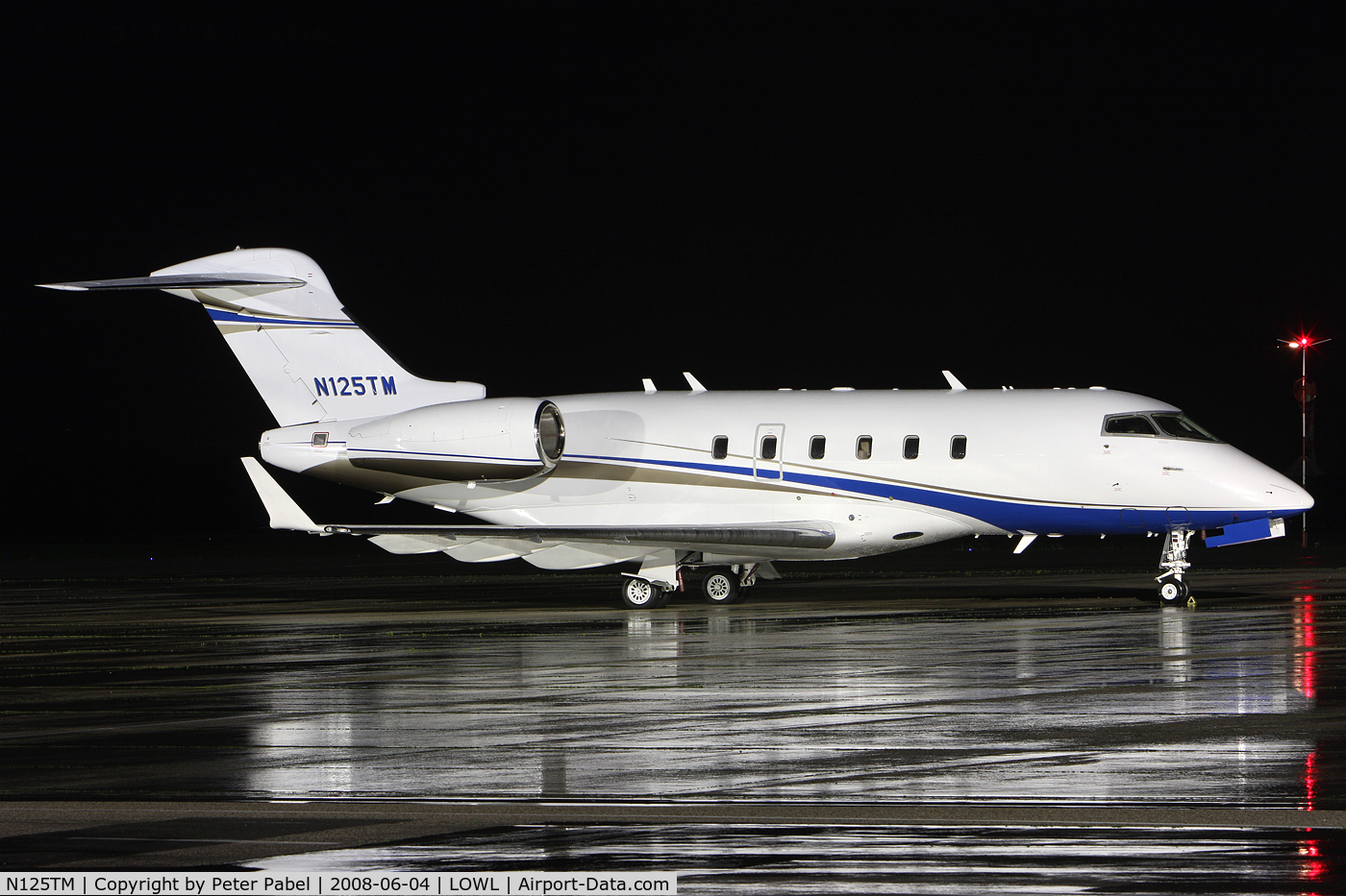 N125TM, 2006 Bombardier Challenger 300 (BD-100-1A10) C/N 20104, nightshot with reflection
