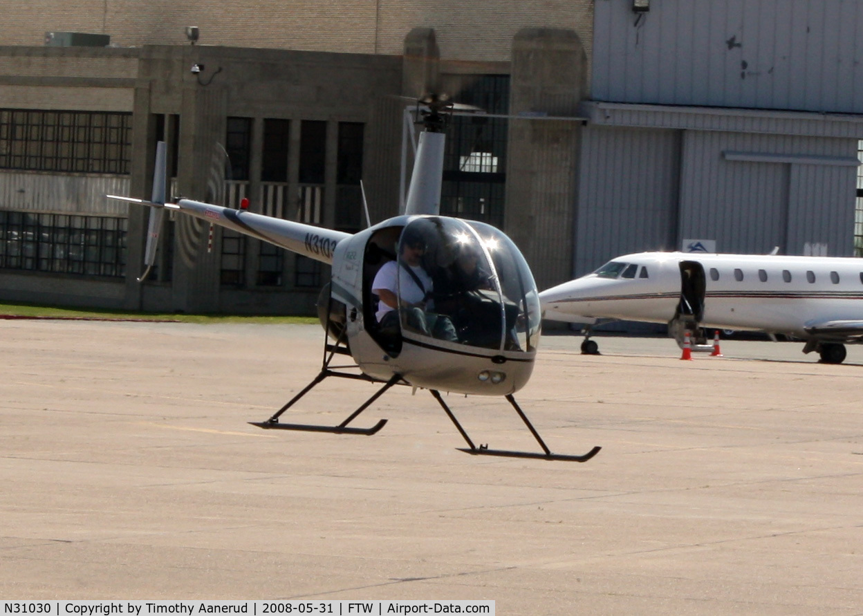 N31030, 2006 Robinson R22 Beta C/N 4059, A Robinson hovering while hovering by in a Huey