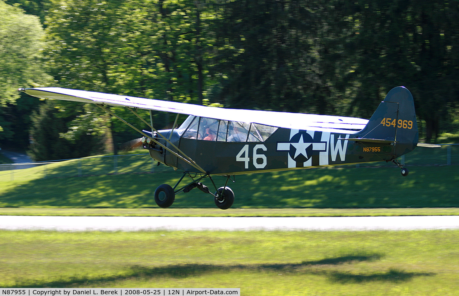 N87955, 1952 Piper J3C-65 Cub C/N 15573, Very cool 1952 Cub chases its shadow as it comes in for a landing.