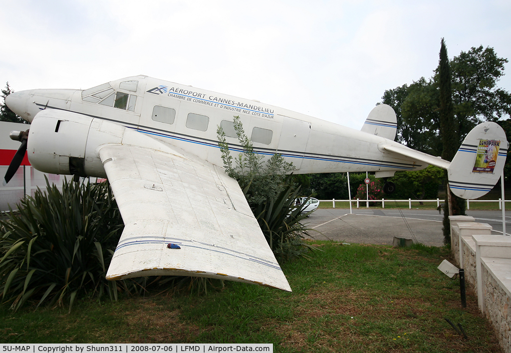 5U-MAP, Beech E-18S C/N BA-184, Preserved at the entrance of the Airport without registration... Ex. Niger Air Force with c/n BA-184