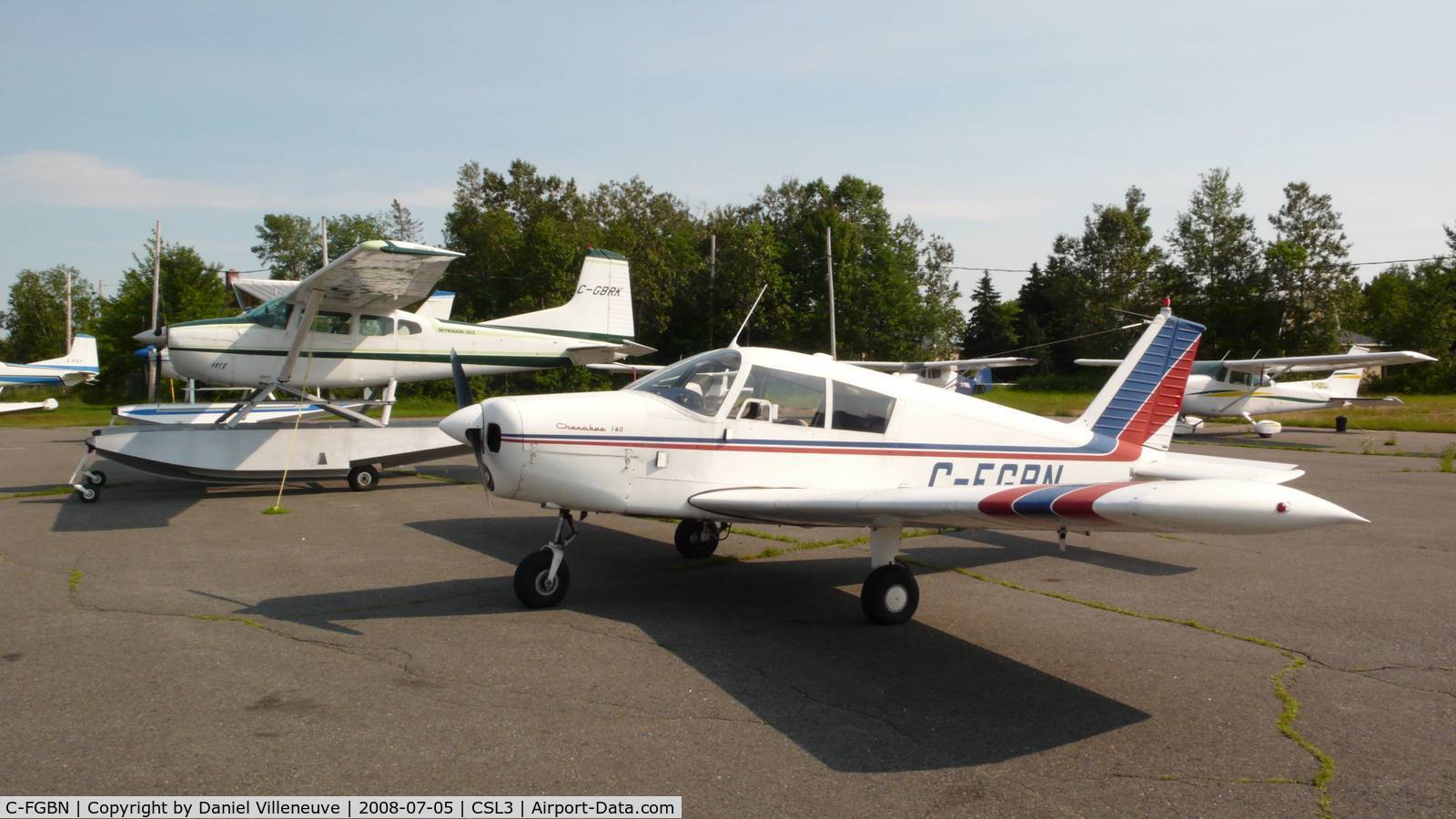 C-FGBN, 1965 Piper PA-28-140 Cherokee C/N 28-20387, C-FGBN parked next to a Cessna 185 at Lac-à-la Tortue