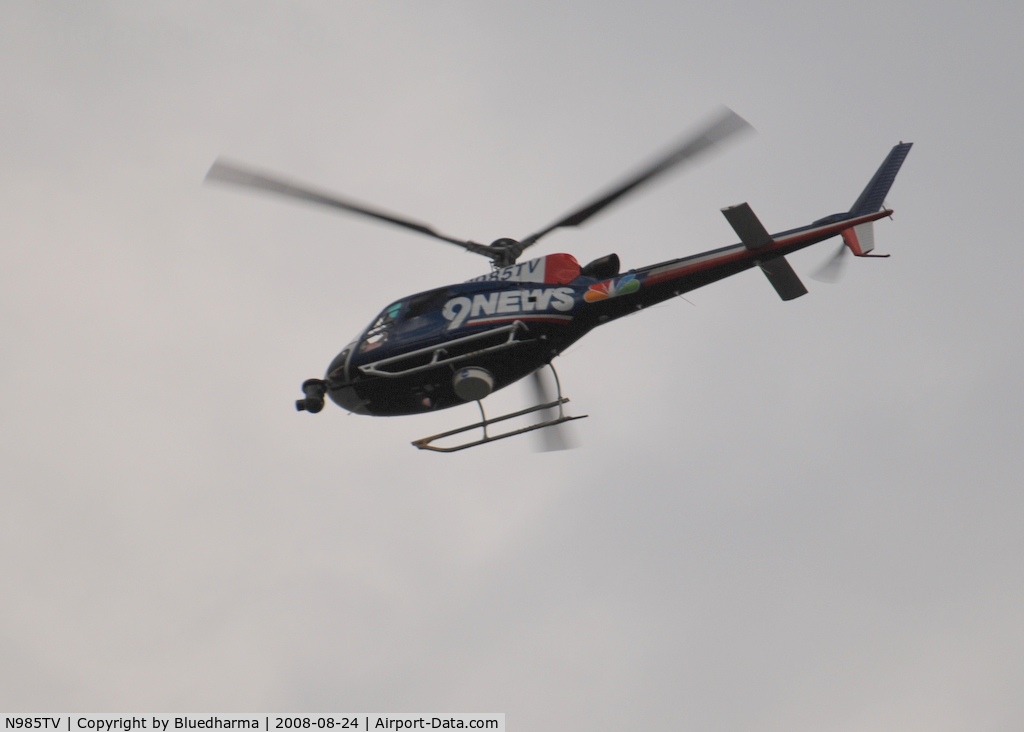 N985TV, 2003 Eurocopter AS-350B-3 Ecureuil Ecureuil C/N 3749, Channel 9 News heading North West around Columbine High School Littleton Colorado.