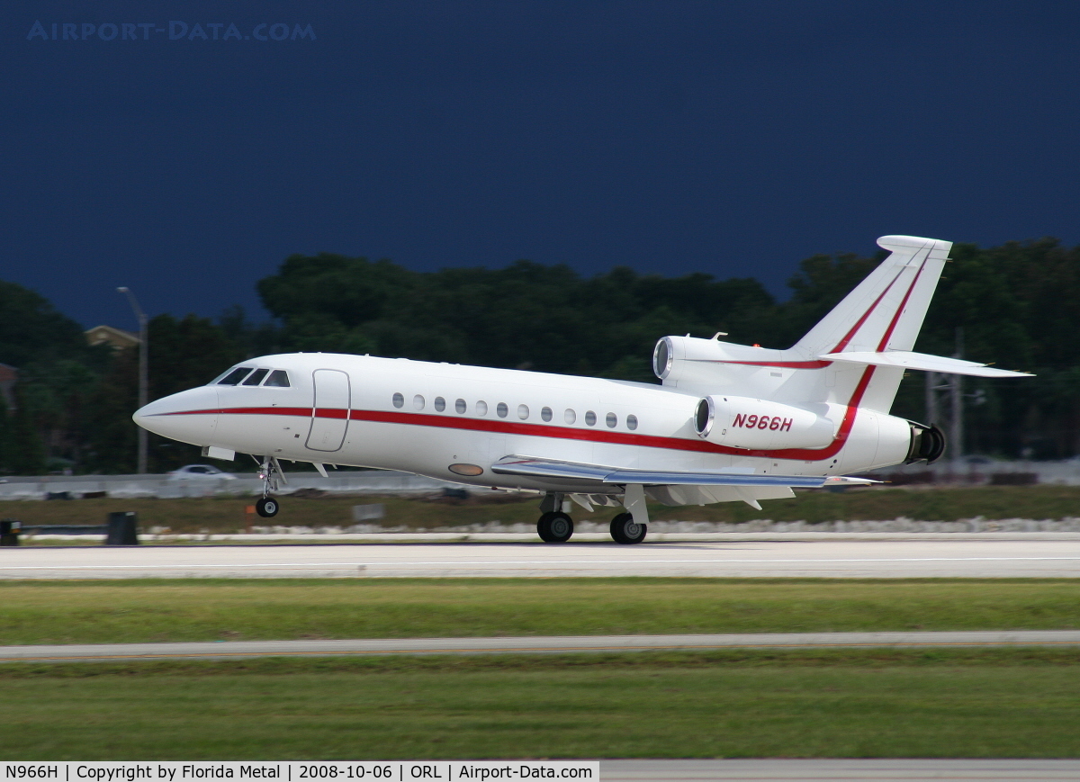 N966H, 2004 Dassault Falcon 900EX C/N 126, Falcon 900EX landing with storm in background