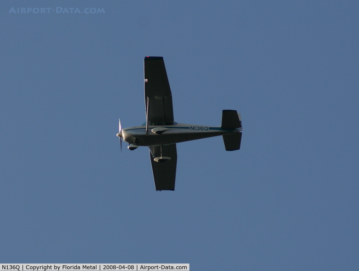 N136Q, 1959 Cessna 182B Skylane C/N 52163, Classic Cessna 182 in holding pattern over Lake Parker on way to Sun N Fun