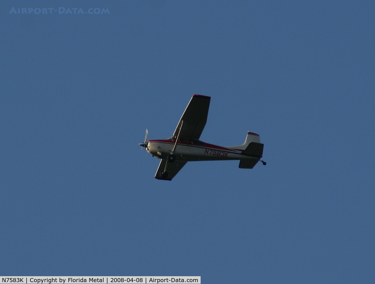 N7583K, 1976 Cessna 180J C/N 18052682, Cessna 180J in holding pattern over Lake Parker on way to Sun N Fun