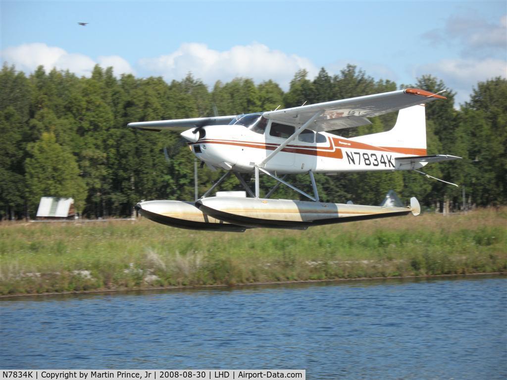 N7834K, 1976 Cessna 180J C/N 18052768, Taking off Lake Hood