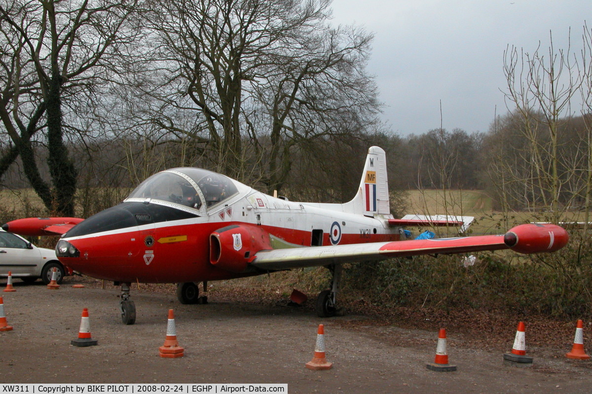 XW311, 1970 BAC 84 Jet Provost T.5 C/N EEP/JP/975, STORED IN THE CAR PARK AT POPHAM. WAS ORIGINALY TO BE DISPLAYED AT A LOCAL GARAGE BUT PLANNING PERMISSION WAS NOT GRANTED.