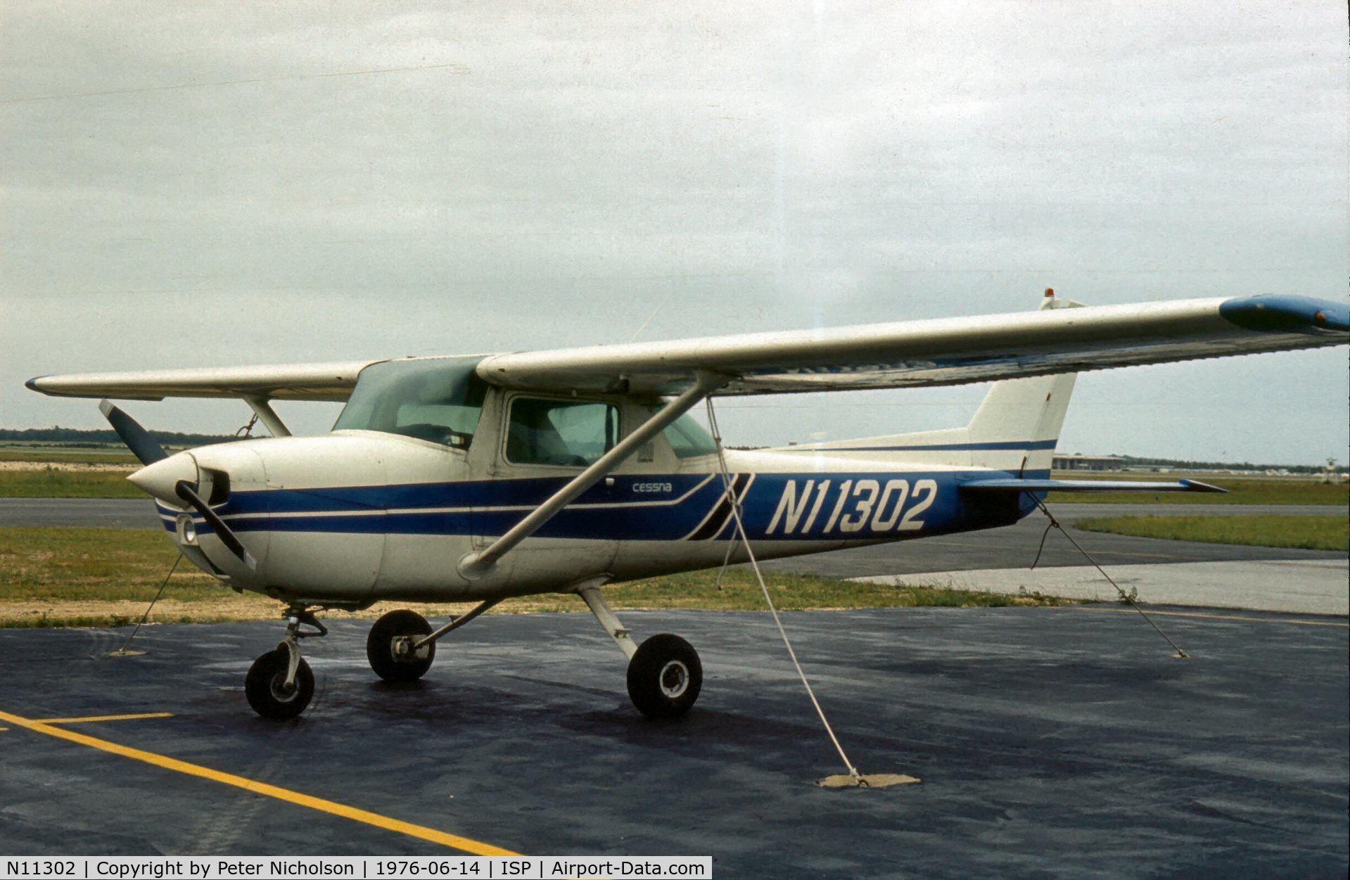 N11302, 1973 Cessna 150L C/N 15075311, This Cessna Commuter was parked at Islip-MacArthur in the summer of 1976.