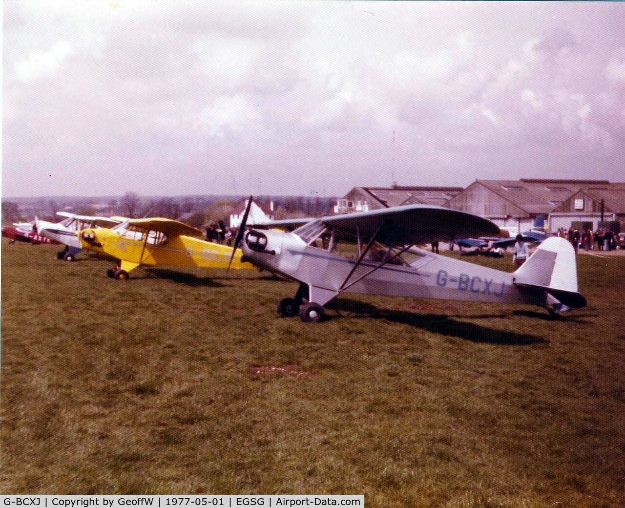 G-BCXJ, 1944 Piper L-4J Grasshopper (J3C-65D) C/N 13048, Taken at a well attended PFA fly-in at Stapleford in 1977