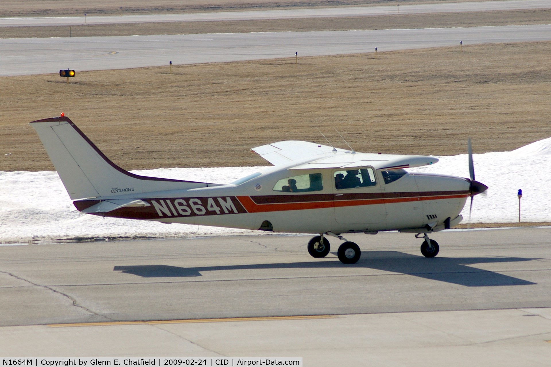 N1664M, 1977 Cessna T210M Turbo Centurion C/N 21061953, Taxiing to Landmark FBO, as seen from my office window.