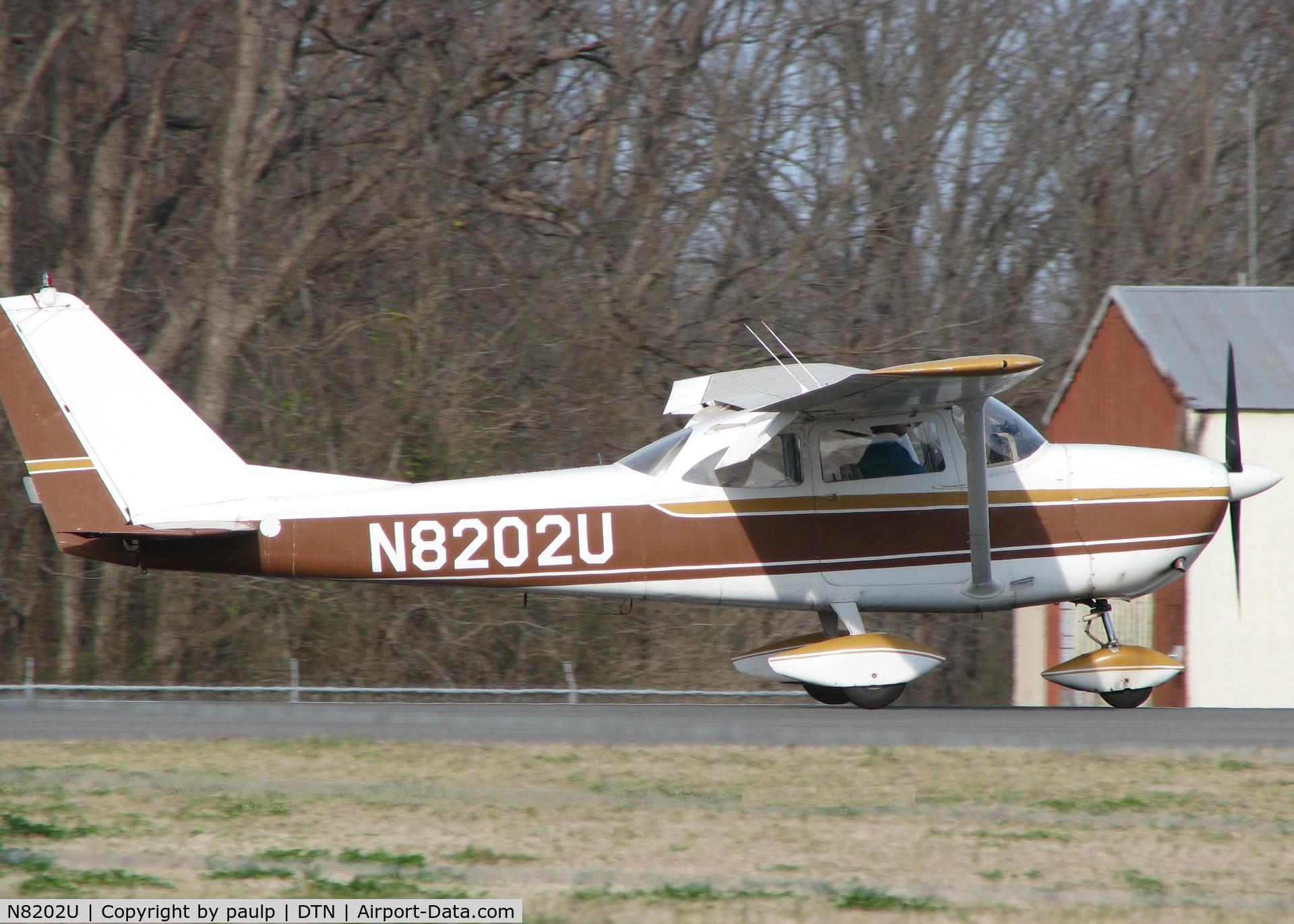 N8202U, 1964 Cessna 172F C/N 17252102, Touching down at Downtown Shreveport.