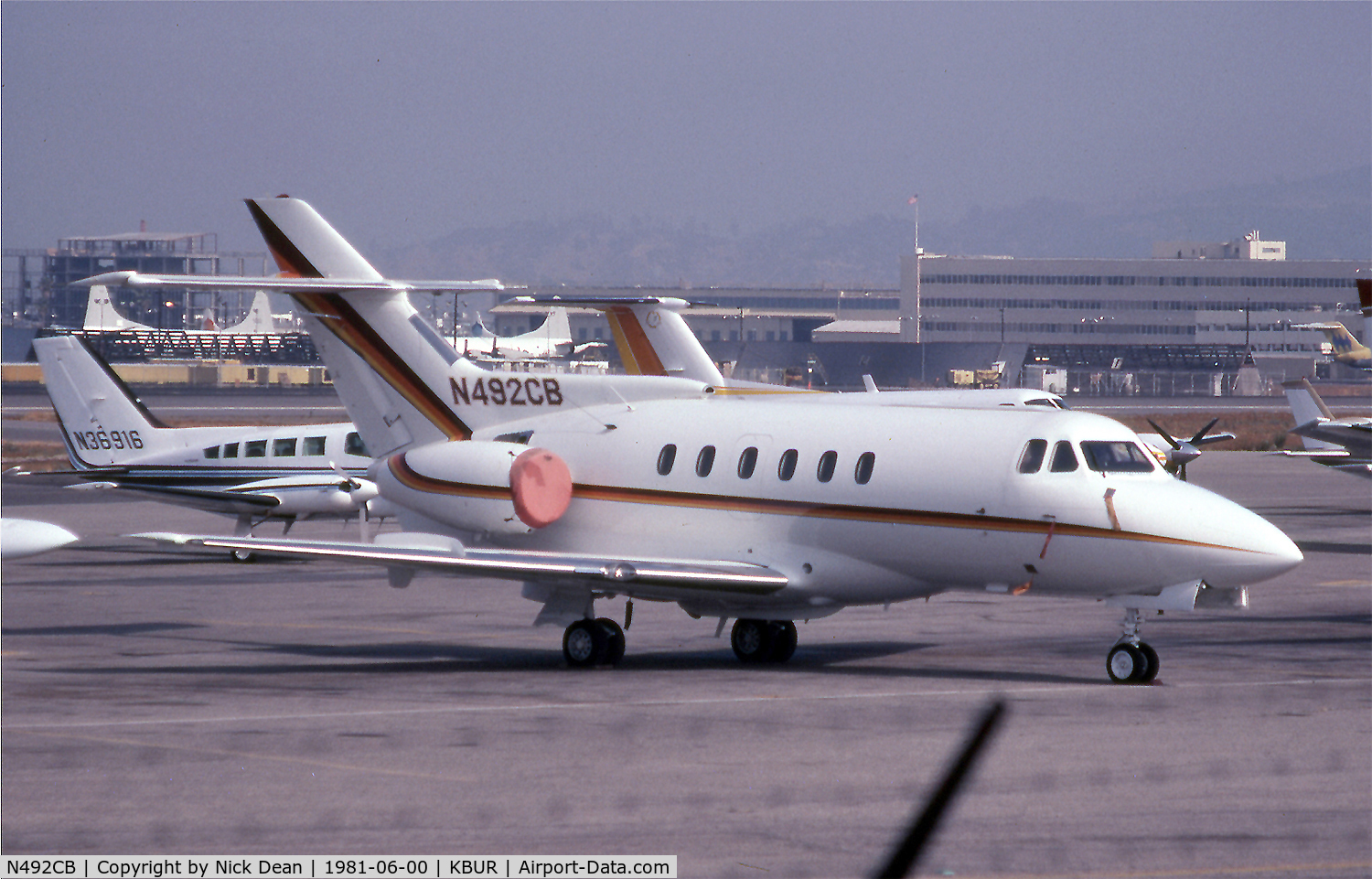 N492CB, 1979 Hawker Siddeley HS125 700A C/N 257056, KBUR (Japanese Navy P-3's prior to delivery on the Lockheed ramp in the background)